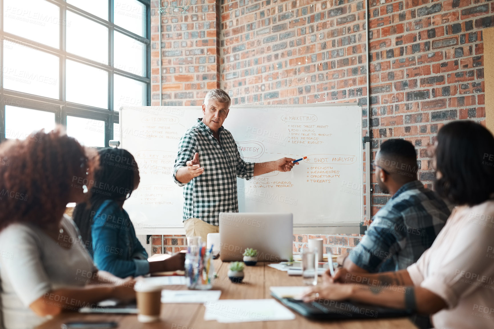 Buy stock photo Shot of a businessman giving a presentation in the boardroom