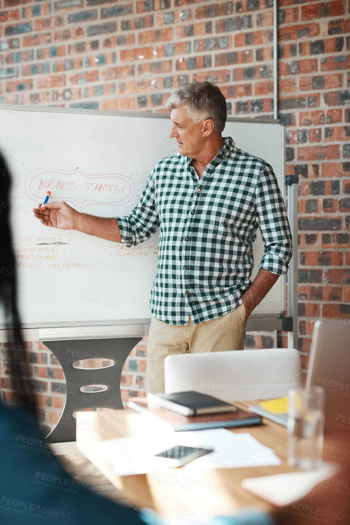 Buy stock photo Discussion, meeting and business man in office for strategy, planning and brainstorming ideas. Manager, creative startup and mature speaker on whiteboard for teamwork, presentation and collaboration