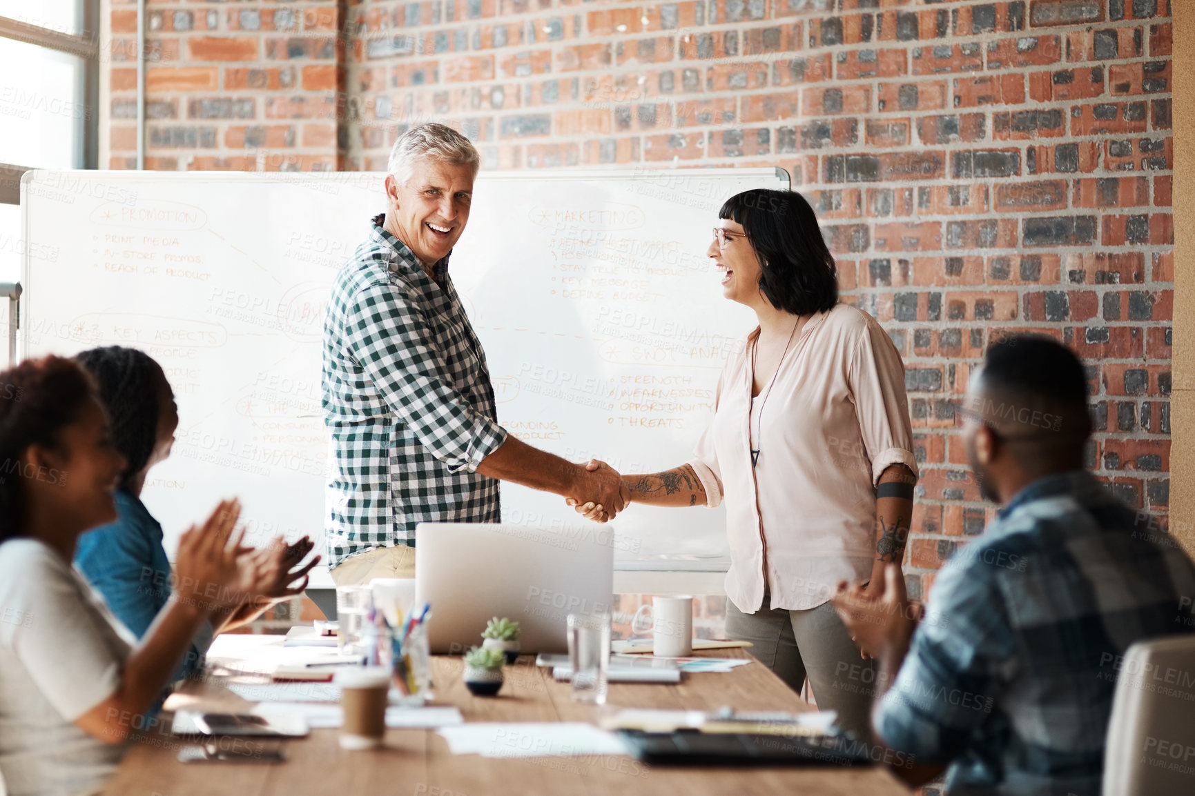 Buy stock photo Man, woman and handshake for welcome to startup with smile, support and introduction to team on office. Business people, leader and shaking hands with new employee with deal, agreement and applause