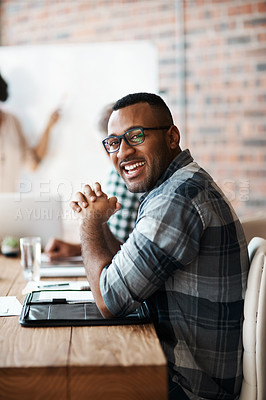 Buy stock photo Portrait of a young businessman sitting in a meeting in the boardroom