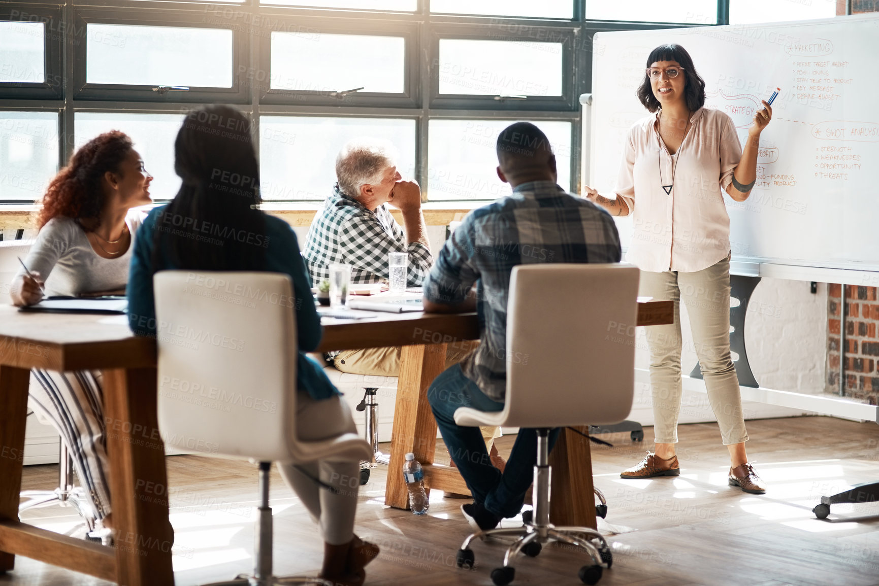 Buy stock photo Shot of a businesswoman giving a presentation in the boardroom