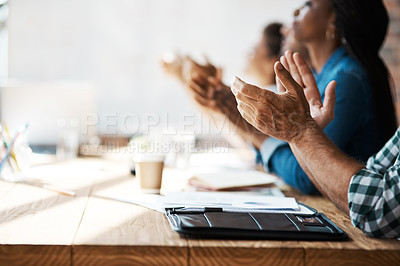 Buy stock photo Shot of a group of businesspeople clapping hands during a boardroom meeting