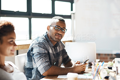 Buy stock photo Portrait of a businessman using a digital tablet during a boardroom meeting