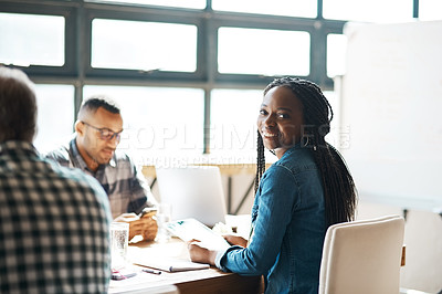 Buy stock photo Portrait of a young businesswoman sitting in a meeting in the boardroom