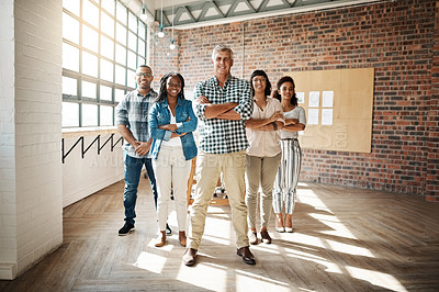 Buy stock photo Portrait of a group of creative businesspeople standing together in an office