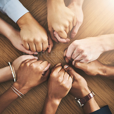 Buy stock photo Community, trust and friends holding hands by table at group counseling or therapy session. Gratitude, love and top view of people in circle for praying together for religion, community and connect.
