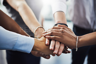Buy stock photo Closeup shot of a group of businesspeople joining their hands together in a huddle