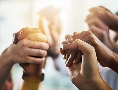 Buy stock photo Closeup shot of a group of businesspeople holding hands together in solidarity