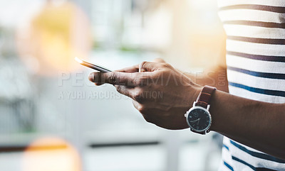 Buy stock photo Closeup shot of a businessman using a cellphone