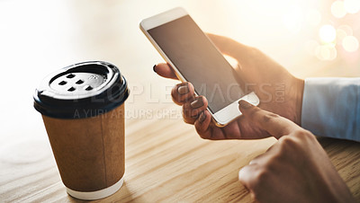 Buy stock photo Closeup shot of a businesswoman using a cellphone while drinking coffee