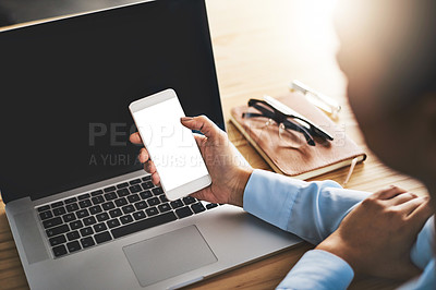 Buy stock photo Closeup shot of a businesswoman using a laptop and cellphone