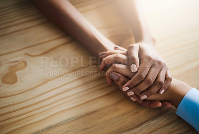 Buy stock photo Compassion, holding hands and support on table for business, helping and of partner in company and solidarity. Unity, entrepreneur and people in office, liquidation and closing of bankrupt startup