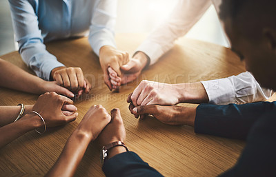 Buy stock photo Unity, compassion and people holding hands by a table at a group counseling or therapy session. Gratitude, trust and friends in a circle for praying together for religion, community and connection.