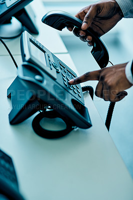 Buy stock photo Closeup shot of unrecognizable businessman using a telephone in an office