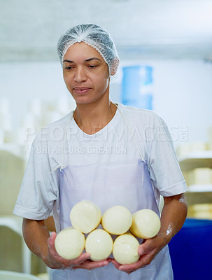 Buy stock photo Cropped shot of a woman working in a cheese factory