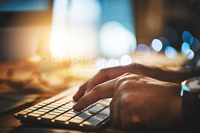 Buy stock photo Cropped shot of a businessman using a computer during a late night at work