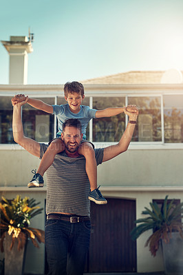 Buy stock photo Shot of a father and son spending the day together at home