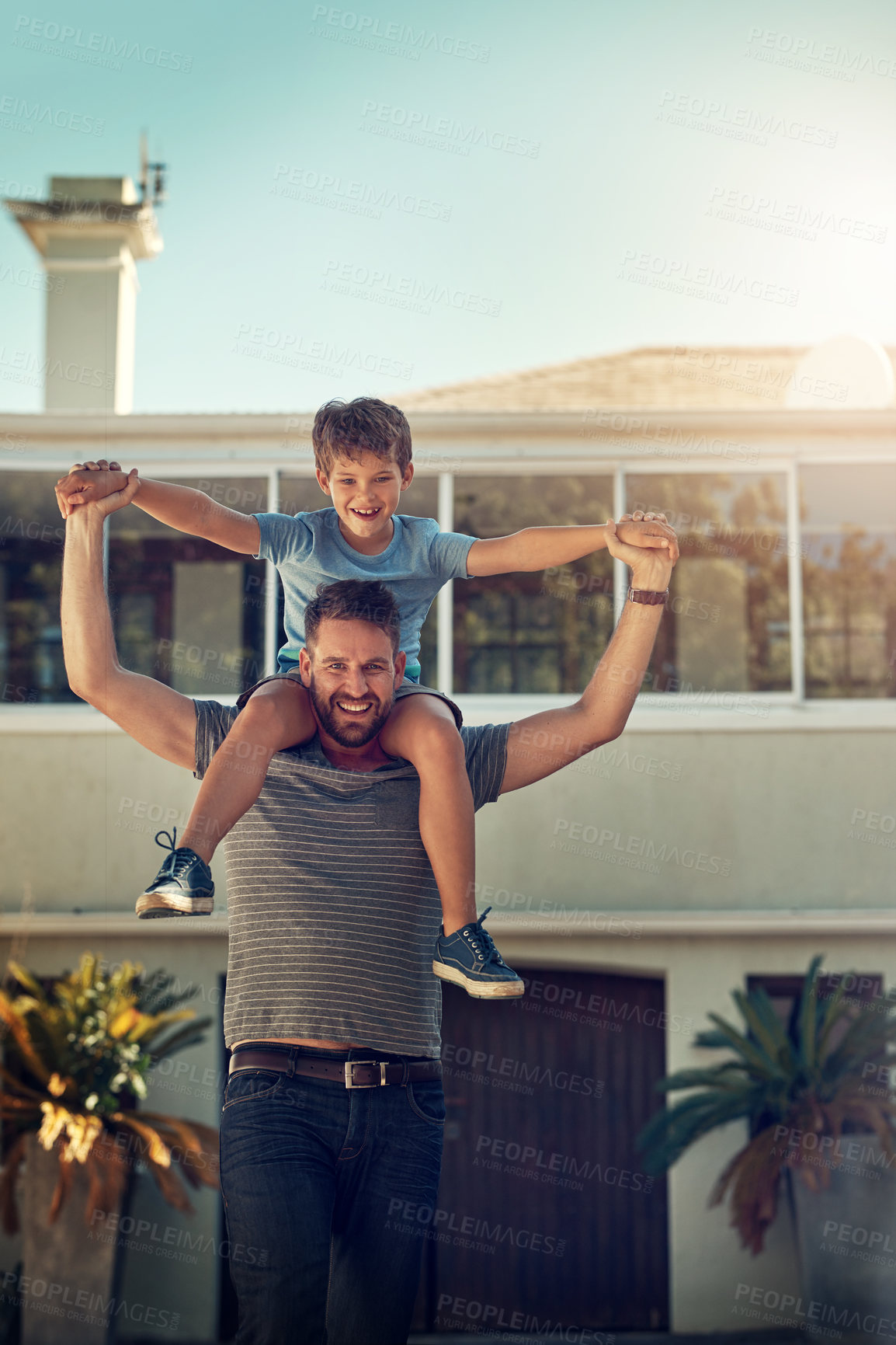 Buy stock photo Shot of a father and son spending the day together at home