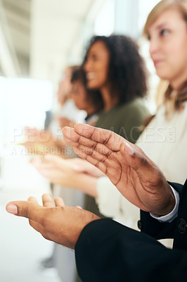 Buy stock photo Cropped shot of an unrecognizable businessman and his colleagues applauding while standing in line during a seminar