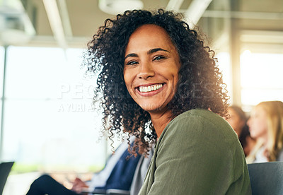 Buy stock photo Cropped portrait of an attractive young businesswoman sitting in a conference room during a seminar