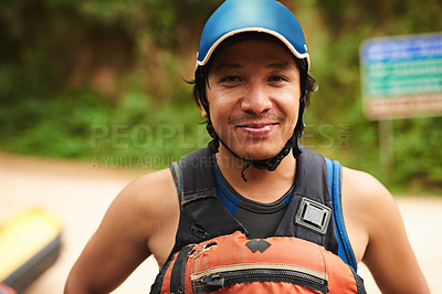 Buy stock photo Cropped portrait of a handsome young man standing outside before going white water rafting
