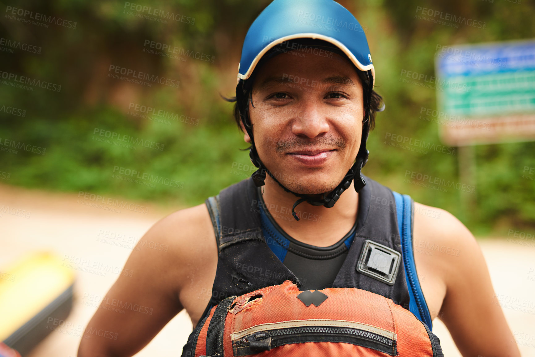 Buy stock photo Cropped portrait of a handsome young man standing outside before going white water rafting