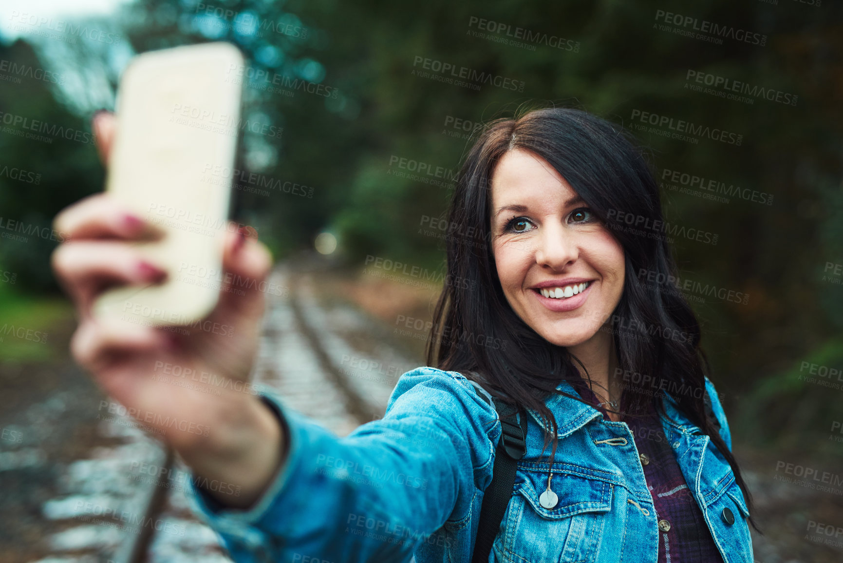 Buy stock photo Woman, selfie and hiking with smile in forest for adventure, travel and outdoor with post on social media. Person, excited and happy with photography, memory or live streaming with trekking in USA