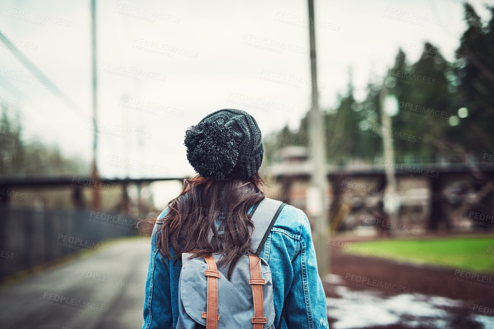 Buy stock photo Rearview shot of an unrecognizable woman walking to the woods