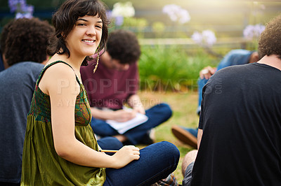 Buy stock photo Cropped shot of a group of college students having a discussion while sitting in a circle outside