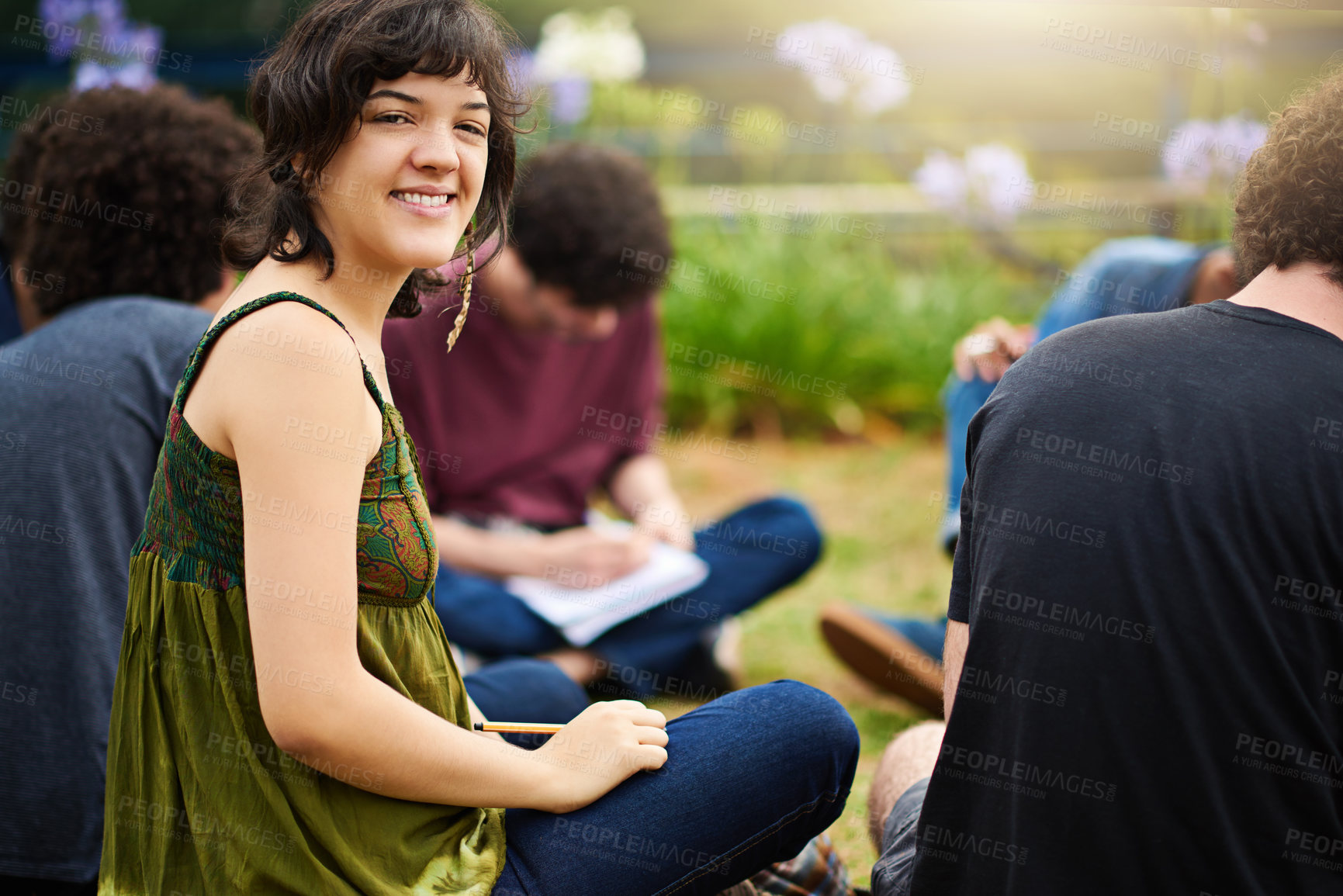 Buy stock photo Cropped shot of a group of college students having a discussion while sitting in a circle outside