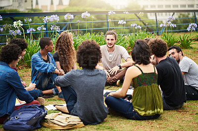 Buy stock photo Cropped shot of a group of college students having a discussion while sitting in a circle outside