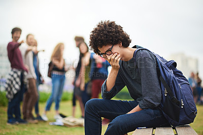 Buy stock photo Cropped shot of a young male college student being teased outside