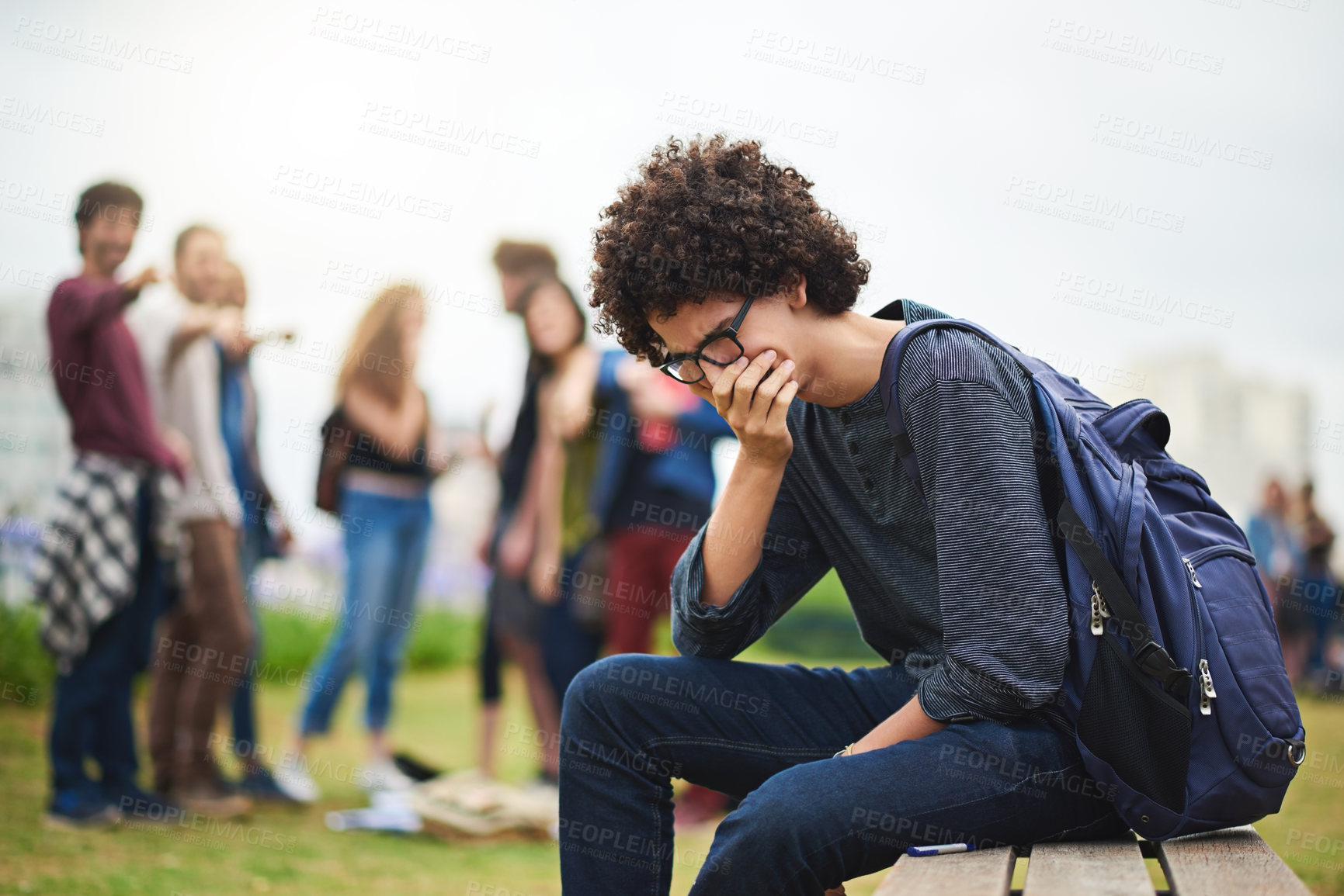 Buy stock photo Cropped shot of a young male college student being teased outside