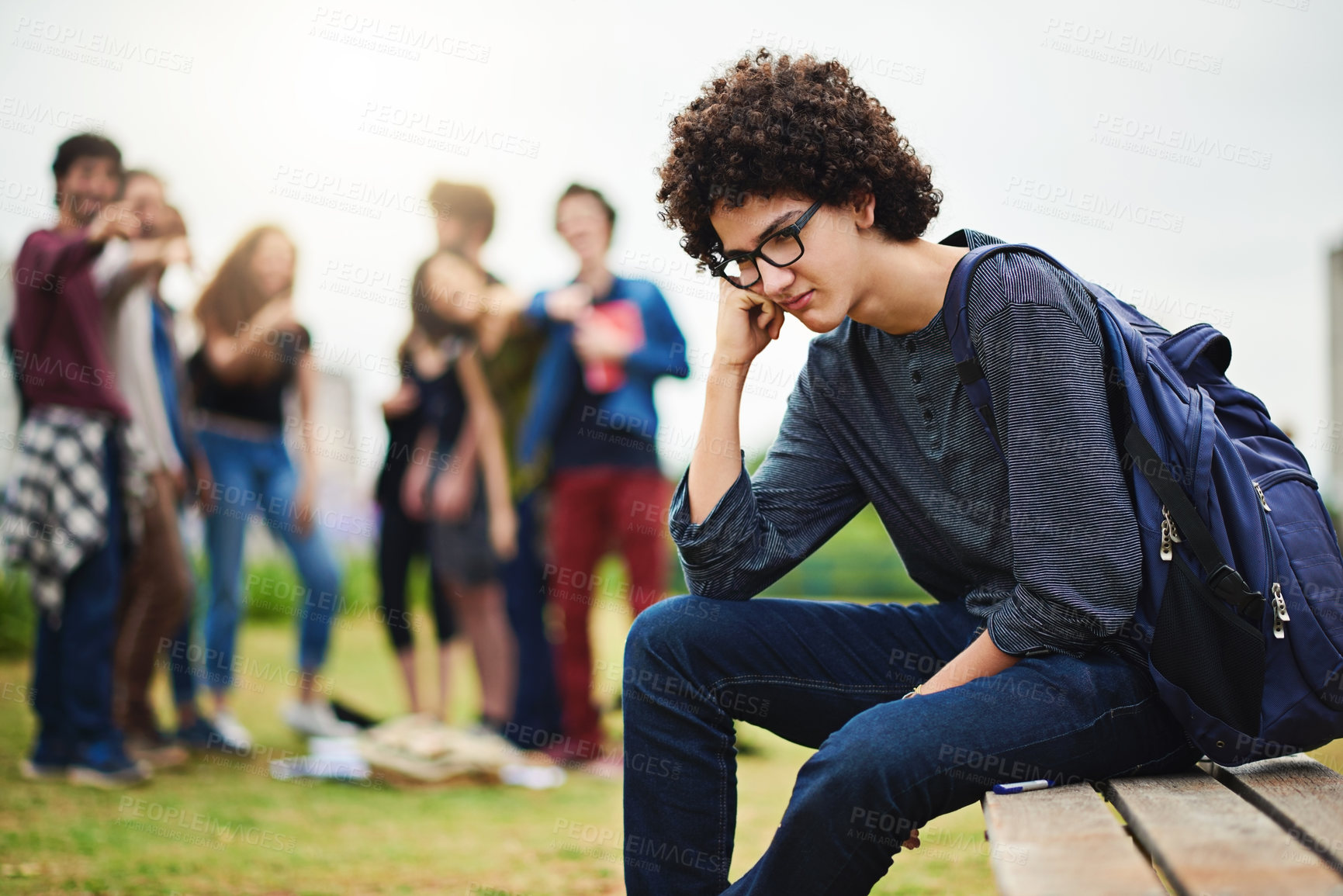 Buy stock photo Cropped shot of a young male college student being teased outside