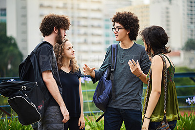 Buy stock photo Cropped shot of a group of college students talking outside