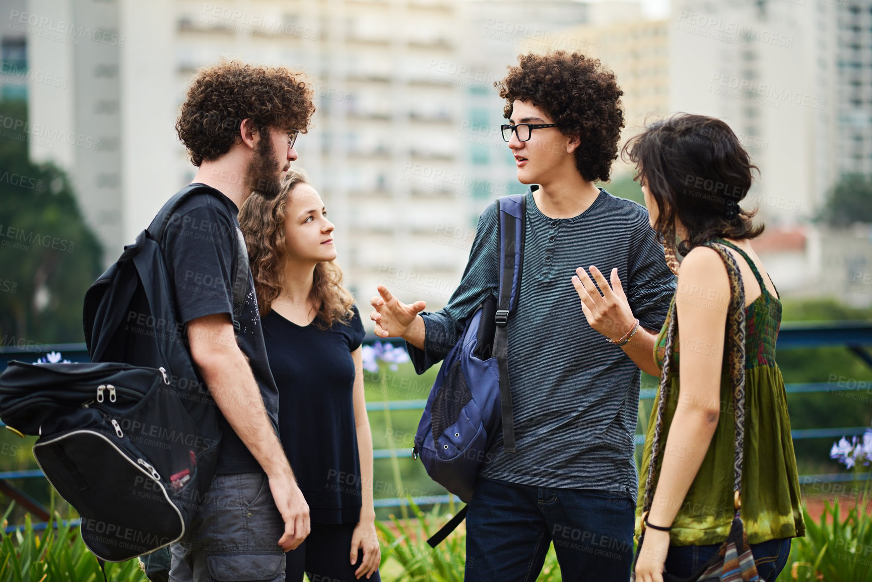 Buy stock photo Cropped shot of a group of college students talking outside