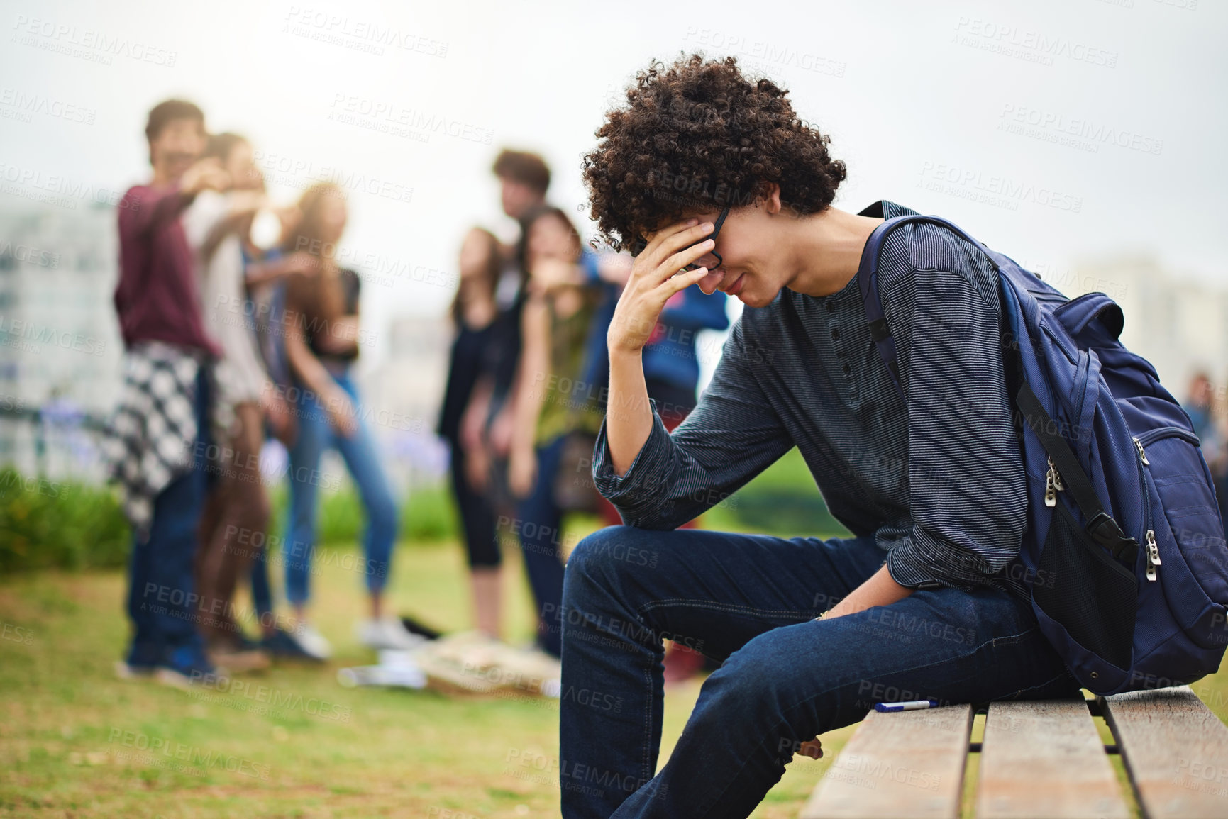 Buy stock photo Cropped shot of a young male college student being teased outside