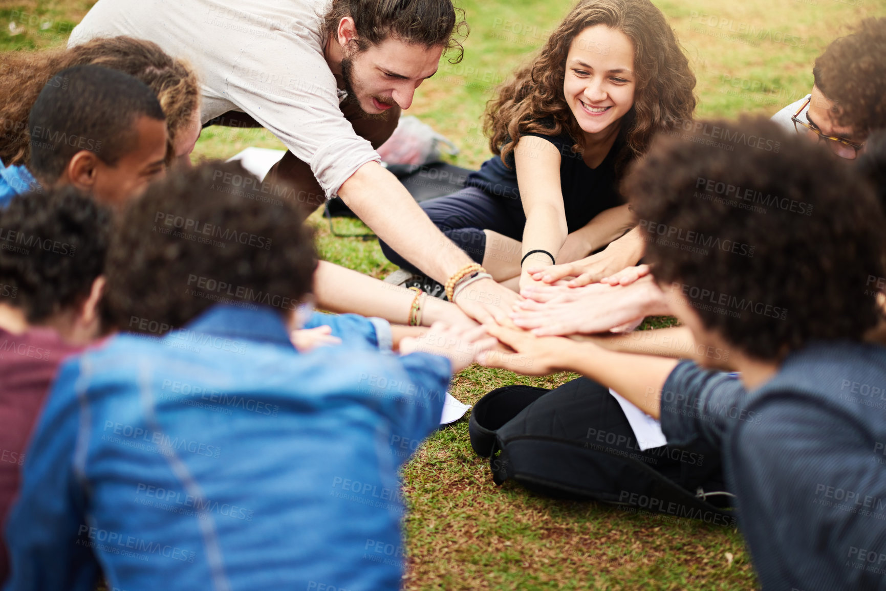 Buy stock photo Cropped shot of a group of college students hands piled on top of each other outside