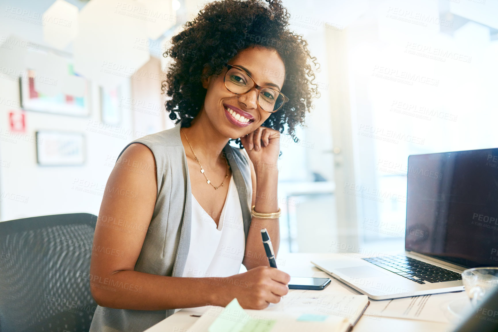 Buy stock photo Shot of a businesswoman working at her desk