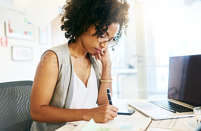 Buy stock photo Shot of a businesswoman working at her desk