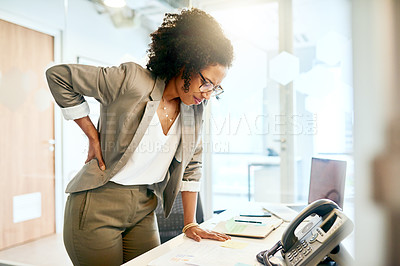 Buy stock photo Shot of a young businesswoman suffering from back pain