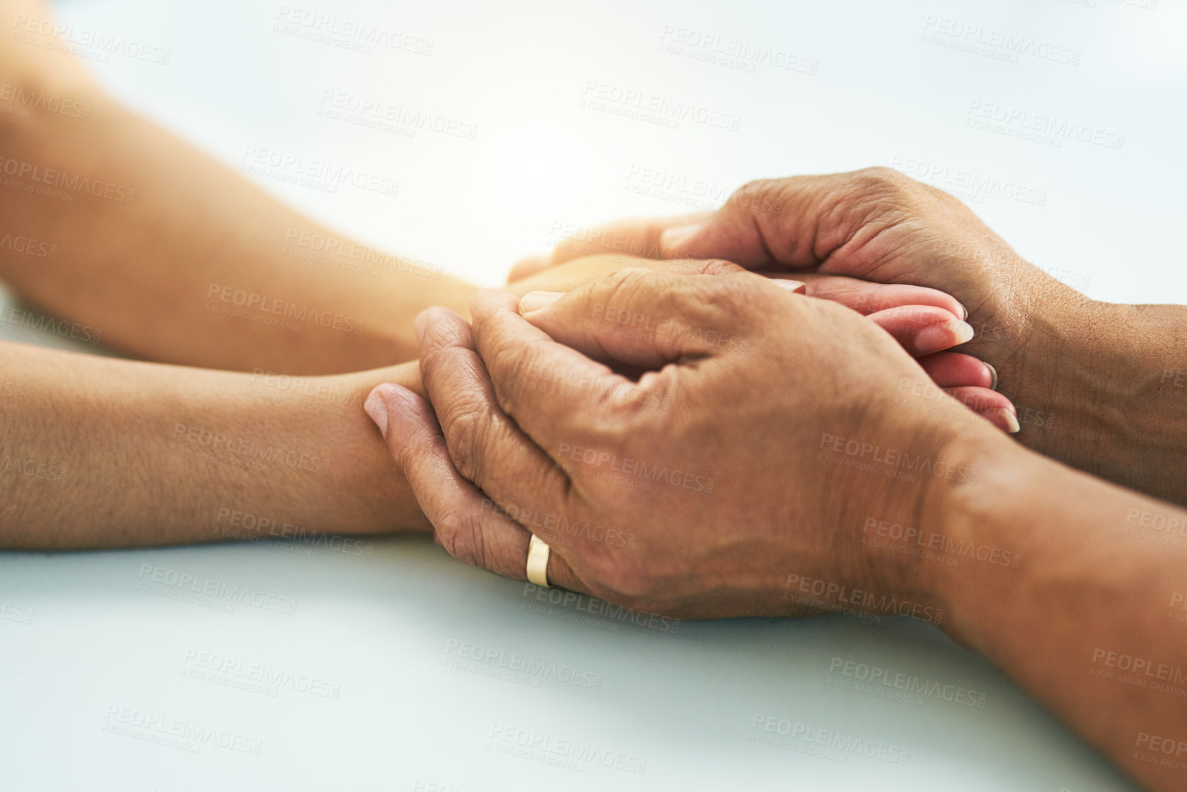 Buy stock photo Doctor, people and holding hands for counseling in hospital, kindness and support for medical news. Physician, patient and help with diagnosis consultation, compassion and specialist for respect