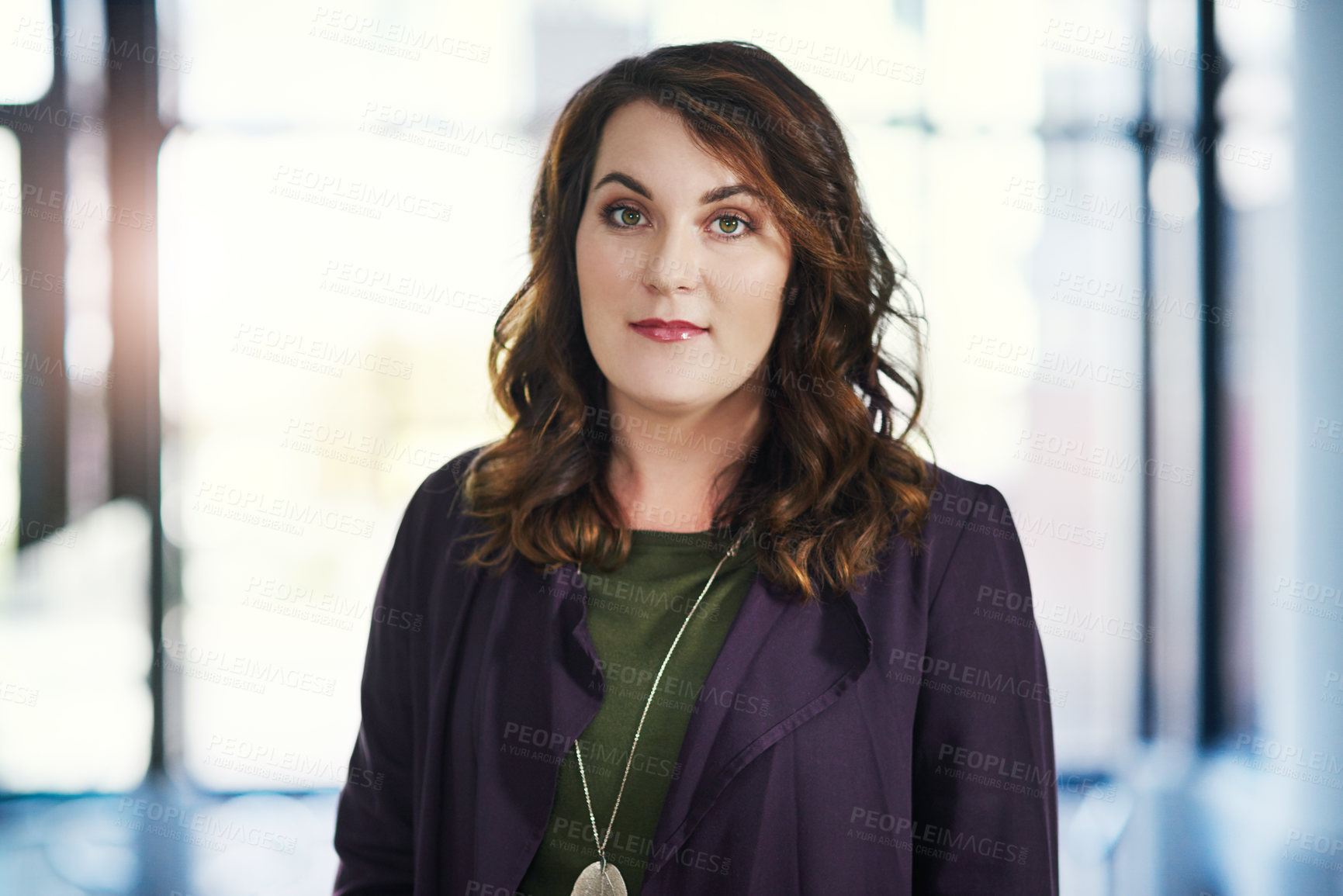 Buy stock photo Portrait of a young businesswoman standing in an office