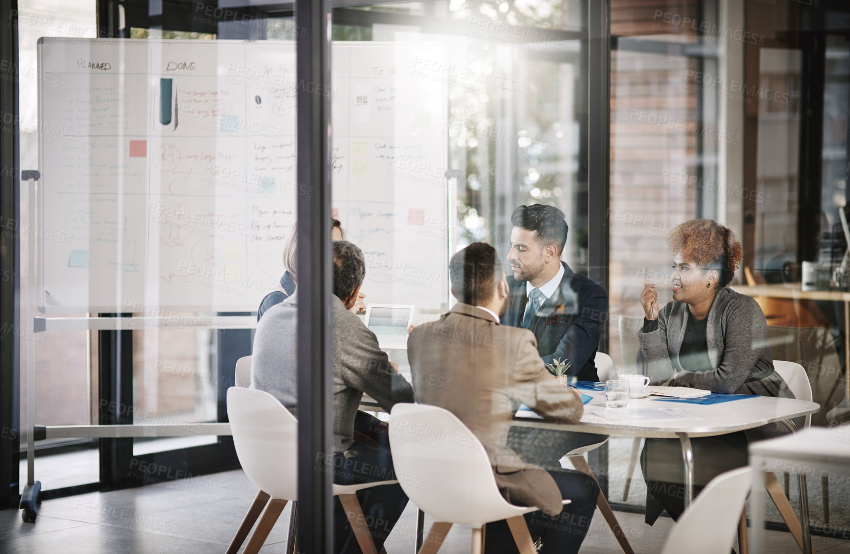 Buy stock photo Presentation, meeting and business people for feedback, glass and partnership in office. B2B deal, team and whiteboard for conversation, advice or merger for collaboration opportunity or agreement