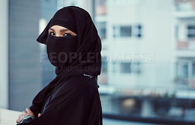 Buy stock photo Cropped portrait of an arabic businesswoman in a burka standing in her office