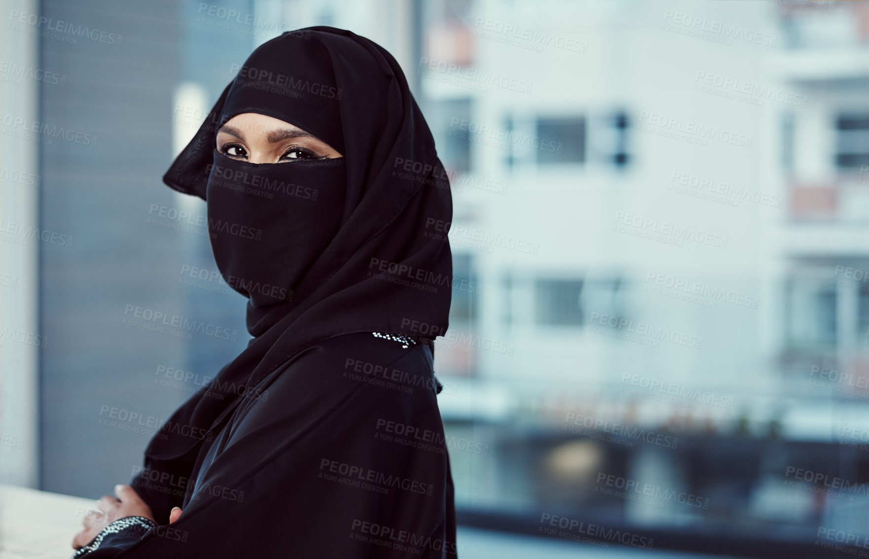 Buy stock photo Cropped portrait of an arabic businesswoman in a burka standing in her office