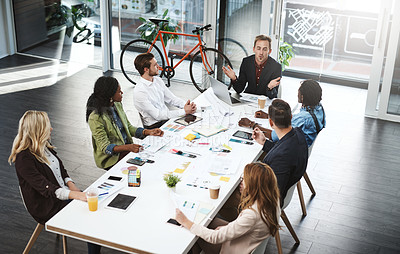 Buy stock photo Shot of a group of businesspeople having a meeting in a boardroom
