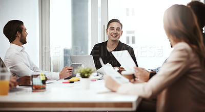 Buy stock photo Shot of a businessman having a meeting with his colleagues in a boardroom