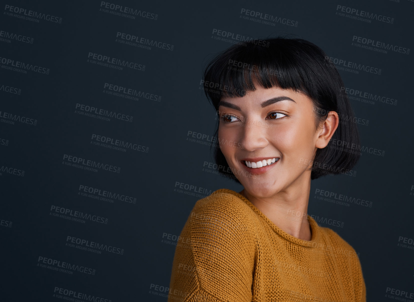 Buy stock photo Asian woman, thinking and smile in studio with space for mockup, reflection or nostalgia by dark background. Girl, person and happy with perspective, memory and inspiration with ideas for future