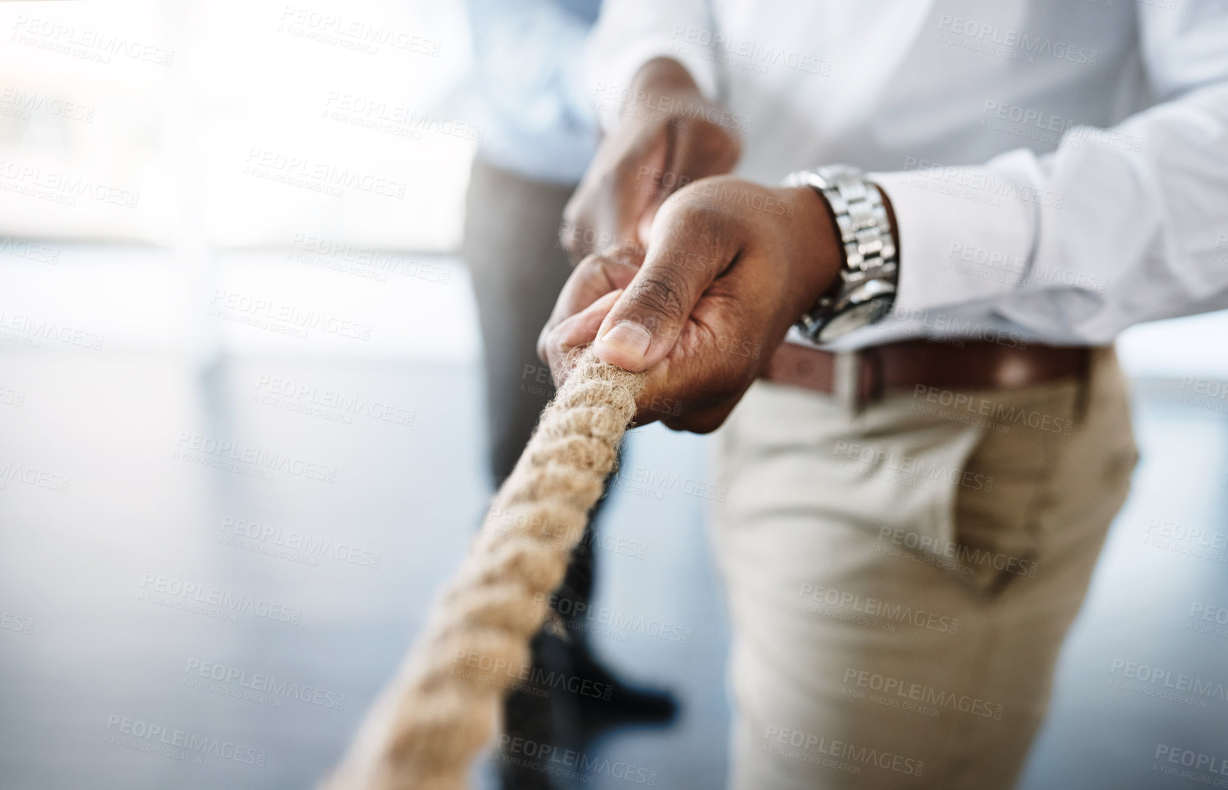 Buy stock photo Hands, competition and tug of war in office with rope for business people, game and solidarity for mission. Contest, link and team building for support, trust and challenge for synergy at workplace